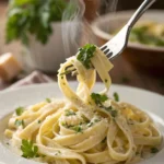 Fettuccine Alfredo in a bowl with creamy sauce